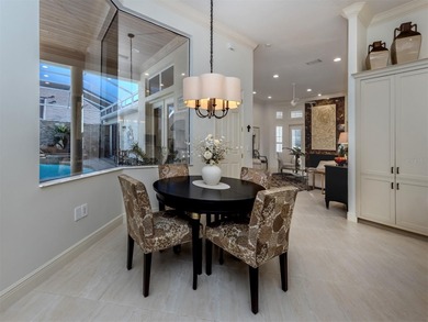 Exuding refined sophistication, this exceptional courtyard on The Venice Golf and Country Club in Florida - for sale on GolfHomes.com, golf home, golf lot