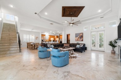 This exquisite custom home, nestled in the secure and golf on Regatta Bay Golf and Country Club in Florida - for sale on GolfHomes.com, golf home, golf lot
