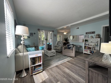 Welcome to this charming 2-bedroom, 2-bathroom coastal condo on Carolina Shores Golf Course in North Carolina - for sale on GolfHomes.com, golf home, golf lot