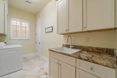 This exquisite custom home, nestled in the secure and golf on Regatta Bay Golf and Country Club in Florida - for sale on GolfHomes.com, golf home, golf lot