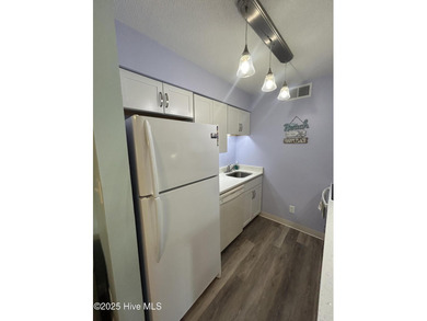 Welcome to this charming 2-bedroom, 2-bathroom coastal condo on Carolina Shores Golf Course in North Carolina - for sale on GolfHomes.com, golf home, golf lot