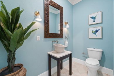 This exquisite custom home, nestled in the secure and golf on Regatta Bay Golf and Country Club in Florida - for sale on GolfHomes.com, golf home, golf lot