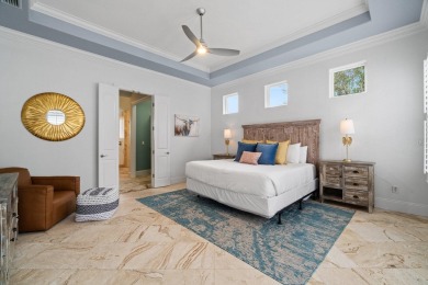 This exquisite custom home, nestled in the secure and golf on Regatta Bay Golf and Country Club in Florida - for sale on GolfHomes.com, golf home, golf lot