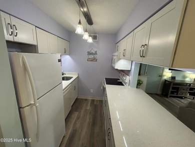 Welcome to this charming 2-bedroom, 2-bathroom coastal condo on Carolina Shores Golf Course in North Carolina - for sale on GolfHomes.com, golf home, golf lot