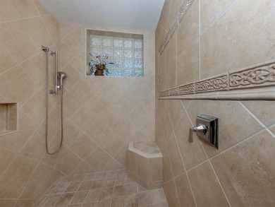 Exuding refined sophistication, this exceptional courtyard on The Venice Golf and Country Club in Florida - for sale on GolfHomes.com, golf home, golf lot