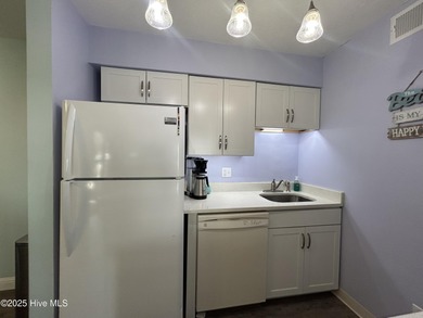 Welcome to this charming 2-bedroom, 2-bathroom coastal condo on Carolina Shores Golf Course in North Carolina - for sale on GolfHomes.com, golf home, golf lot