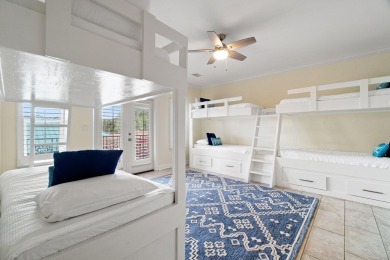 This exquisite custom home, nestled in the secure and golf on Regatta Bay Golf and Country Club in Florida - for sale on GolfHomes.com, golf home, golf lot