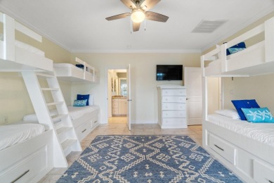 This exquisite custom home, nestled in the secure and golf on Regatta Bay Golf and Country Club in Florida - for sale on GolfHomes.com, golf home, golf lot