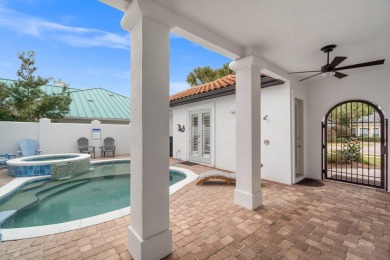 This exquisite custom home, nestled in the secure and golf on Regatta Bay Golf and Country Club in Florida - for sale on GolfHomes.com, golf home, golf lot