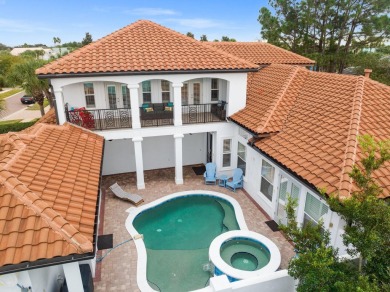 This exquisite custom home, nestled in the secure and golf on Regatta Bay Golf and Country Club in Florida - for sale on GolfHomes.com, golf home, golf lot