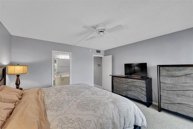 BEAUTIFUL 2 BEDROOM 2 BATH WITH MAGNIFICENT LAKE AND FOUNTAIN on Wynmoor Golf Course in Florida - for sale on GolfHomes.com, golf home, golf lot