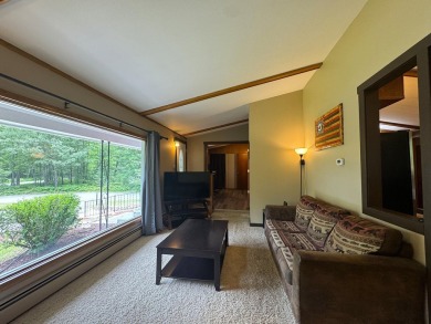 Located in the BRINKLAND neighborhood, this 3BD/2.5BA ranch home on Minocqua Country Club in Wisconsin - for sale on GolfHomes.com, golf home, golf lot