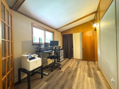 Located in the BRINKLAND neighborhood, this 3BD/2.5BA ranch home on Minocqua Country Club in Wisconsin - for sale on GolfHomes.com, golf home, golf lot