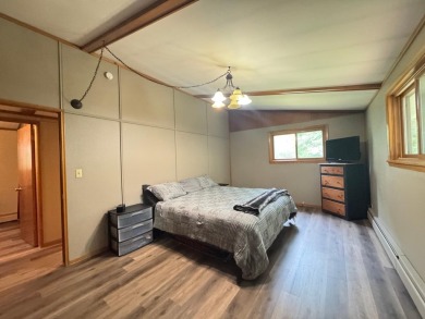 Located in the BRINKLAND neighborhood, this 3BD/2.5BA ranch home on Minocqua Country Club in Wisconsin - for sale on GolfHomes.com, golf home, golf lot