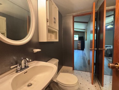 Located in the BRINKLAND neighborhood, this 3BD/2.5BA ranch home on Minocqua Country Club in Wisconsin - for sale on GolfHomes.com, golf home, golf lot