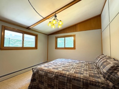Located in the BRINKLAND neighborhood, this 3BD/2.5BA ranch home on Minocqua Country Club in Wisconsin - for sale on GolfHomes.com, golf home, golf lot
