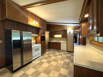 Located in the BRINKLAND neighborhood, this 3BD/2.5BA ranch home on Minocqua Country Club in Wisconsin - for sale on GolfHomes.com, golf home, golf lot