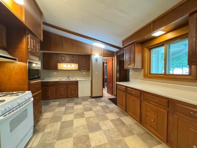Located in the BRINKLAND neighborhood, this 3BD/2.5BA ranch home on Minocqua Country Club in Wisconsin - for sale on GolfHomes.com, golf home, golf lot