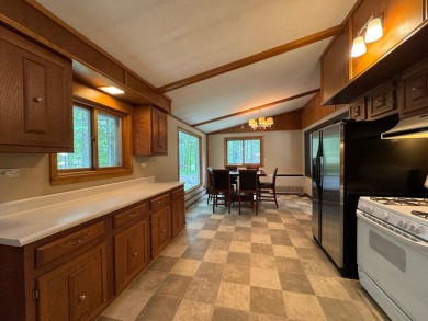Located in the BRINKLAND neighborhood, this 3BD/2.5BA ranch home on Minocqua Country Club in Wisconsin - for sale on GolfHomes.com, golf home, golf lot