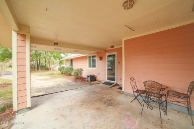 NEWLY PAINTED!!  Cozy 3 bedroom, 2 bath home on a spacious on Diamondhead Country Club in Mississippi - for sale on GolfHomes.com, golf home, golf lot