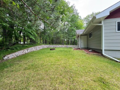 Located in the BRINKLAND neighborhood, this 3BD/2.5BA ranch home on Minocqua Country Club in Wisconsin - for sale on GolfHomes.com, golf home, golf lot