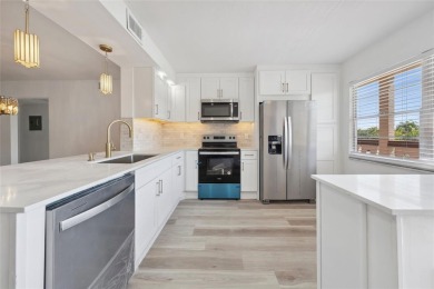 Stunning unit in Wynmoor! Overlooking scenic golf course, this on Wynmoor Golf Course in Florida - for sale on GolfHomes.com, golf home, golf lot