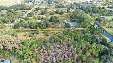 Wedgefield Opportunity! Nearly 5 acres of land--cleared and on Wedgefield Golf Club in Florida - for sale on GolfHomes.com, golf home, golf lot