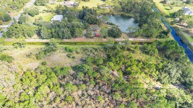 Wedgefield Opportunity! Nearly 5 acres of land--cleared and on Wedgefield Golf Club in Florida - for sale on GolfHomes.com, golf home, golf lot