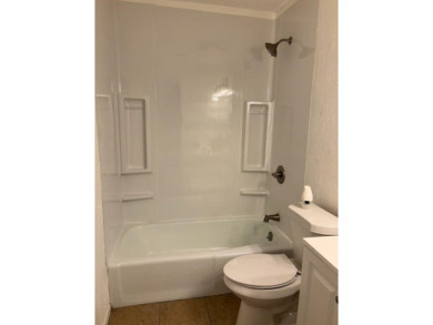 This large 2 bedroom (could be 3) 2 bath townhouse is in the on Cherokee Village North Course in Arkansas - for sale on GolfHomes.com, golf home, golf lot
