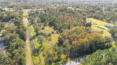 Wedgefield Opportunity! Nearly 5 acres of land--cleared and on Wedgefield Golf Club in Florida - for sale on GolfHomes.com, golf home, golf lot