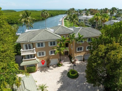 Enjoy picturesque down canal views with this well appointed on Card Sound Golf Club in Florida - for sale on GolfHomes.com, golf home, golf lot