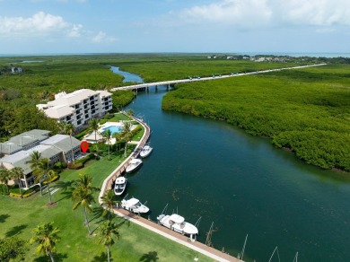 Enjoy picturesque down canal views with this well appointed on Card Sound Golf Club in Florida - for sale on GolfHomes.com, golf home, golf lot