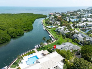 Enjoy picturesque down canal views with this well appointed on Card Sound Golf Club in Florida - for sale on GolfHomes.com, golf home, golf lot