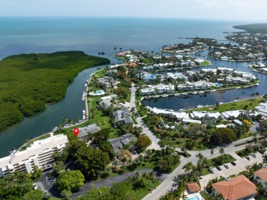 Enjoy picturesque down canal views with this well appointed on Card Sound Golf Club in Florida - for sale on GolfHomes.com, golf home, golf lot