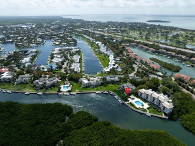 Enjoy picturesque down canal views with this well appointed on Card Sound Golf Club in Florida - for sale on GolfHomes.com, golf home, golf lot