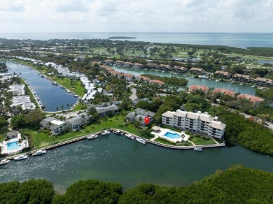 Enjoy picturesque down canal views with this well appointed on Card Sound Golf Club in Florida - for sale on GolfHomes.com, golf home, golf lot