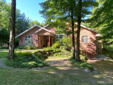 This executive home features 6750 sq. ft. Conveniently located on Marquette Golf Club in Michigan - for sale on GolfHomes.com, golf home, golf lot