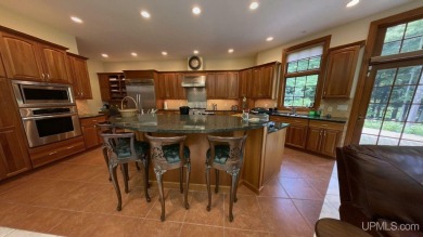 This executive home features 6750 sq. ft. Conveniently located on Marquette Golf Club in Michigan - for sale on GolfHomes.com, golf home, golf lot