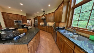 This executive home features 6750 sq. ft. Conveniently located on Marquette Golf Club in Michigan - for sale on GolfHomes.com, golf home, golf lot