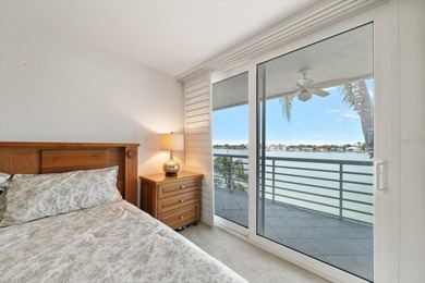 Under contract-accepting backup offers. WATERFRONT LIVING WITH on Isla Del Sol Yacht and Country Club in Florida - for sale on GolfHomes.com, golf home, golf lot