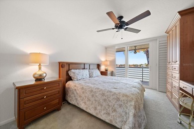 Under contract-accepting backup offers. WATERFRONT LIVING WITH on Isla Del Sol Yacht and Country Club in Florida - for sale on GolfHomes.com, golf home, golf lot