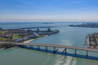 Under contract-accepting backup offers. WATERFRONT LIVING WITH on Isla Del Sol Yacht and Country Club in Florida - for sale on GolfHomes.com, golf home, golf lot