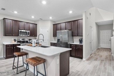 This perfectly maintained, low-maintenance townhome is ready for on Golf Club At South Hampton in Florida - for sale on GolfHomes.com, golf home, golf lot