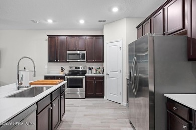 This perfectly maintained, low-maintenance townhome is ready for on Golf Club At South Hampton in Florida - for sale on GolfHomes.com, golf home, golf lot