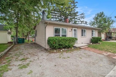 Nestled at the end of a quiet dead-end street, this beautifully on Lake Erie Metropark Golf Course in Michigan - for sale on GolfHomes.com, golf home, golf lot