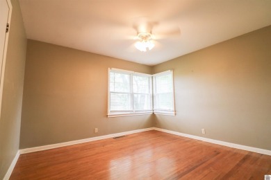 This charming 3-bedroom, 1-bathroom home offers incredible on Rolling Hills Country Club in Kentucky - for sale on GolfHomes.com, golf home, golf lot