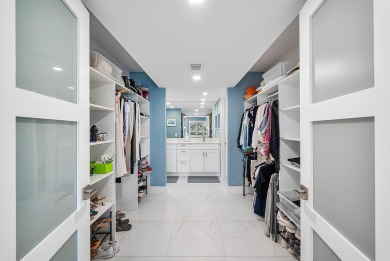 Welcome to this inviting 1st‑floor home showcasing serene on Quail Ridge Golf Course and Country Club in Florida - for sale on GolfHomes.com, golf home, golf lot
