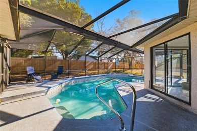 Under contract-accepting backup offers. Tucked onto a generous 0 on Spring Hill Golf Course in Florida - for sale on GolfHomes.com, golf home, golf lot