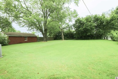 This charming 3-bedroom, 1-bathroom home offers incredible on Rolling Hills Country Club in Kentucky - for sale on GolfHomes.com, golf home, golf lot