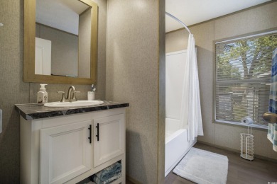 Welcome to your dream retreat! This delightful 3-bedroom on Whispering Pines in South Carolina - for sale on GolfHomes.com, golf home, golf lot